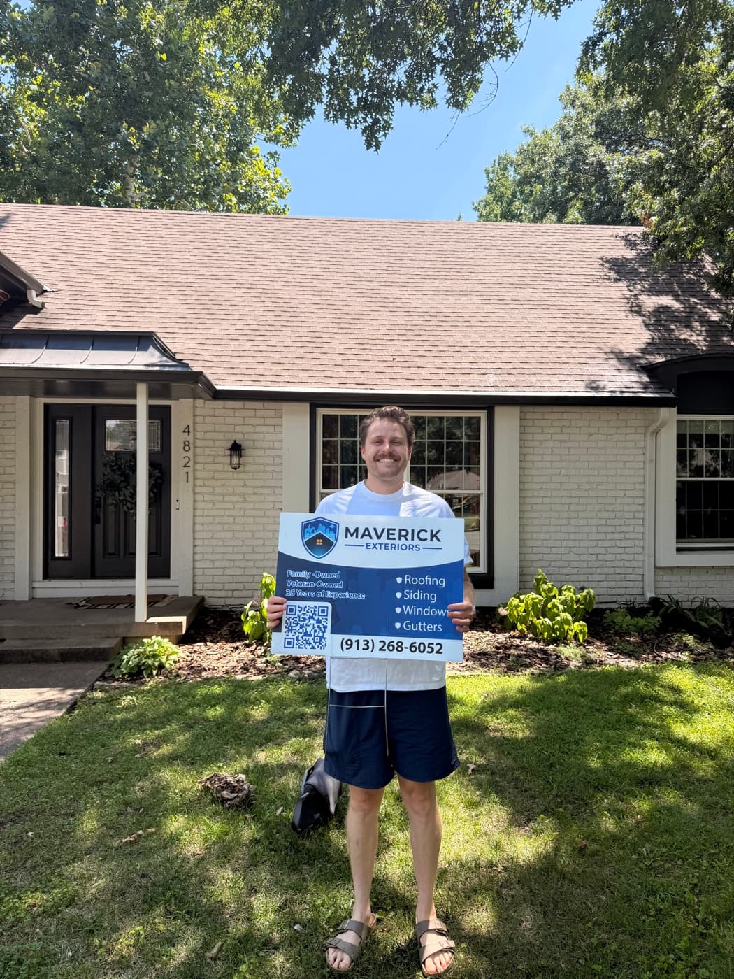 Maverick customer outside a completed Kansas City roofing project